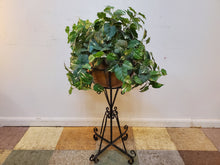 Load image into Gallery viewer, Faux Vine Plant In Round Planter Pot and Wrought Iron Plant Stand