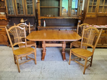 Load image into Gallery viewer, Vintage Oak Trestle Base Dining Table Set With 2 Hidden Leaves and 4 Comb Back Chairs By S Bent Bros
